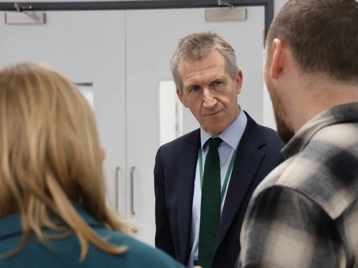 Minister of State for Security Dan Jarvis speaks to two members of HMGCC staff.