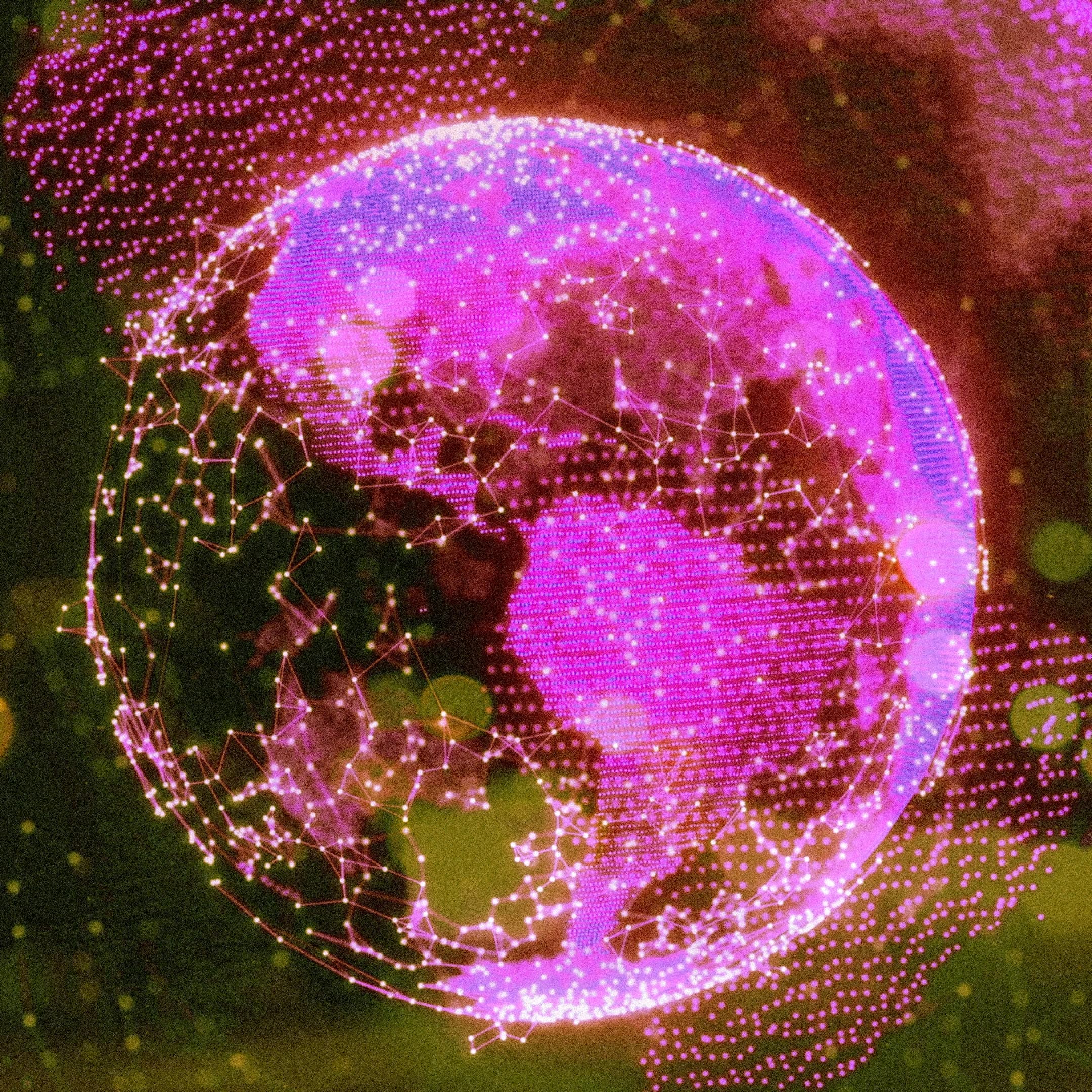 Image shows a globe style image of the earth in shades of pink