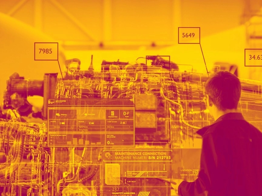 Image shows man looking at a range of technology and machinery