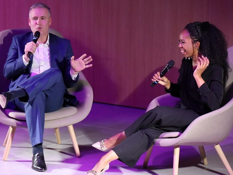 HMGCC CEO George Williamson sits on stage alongside 