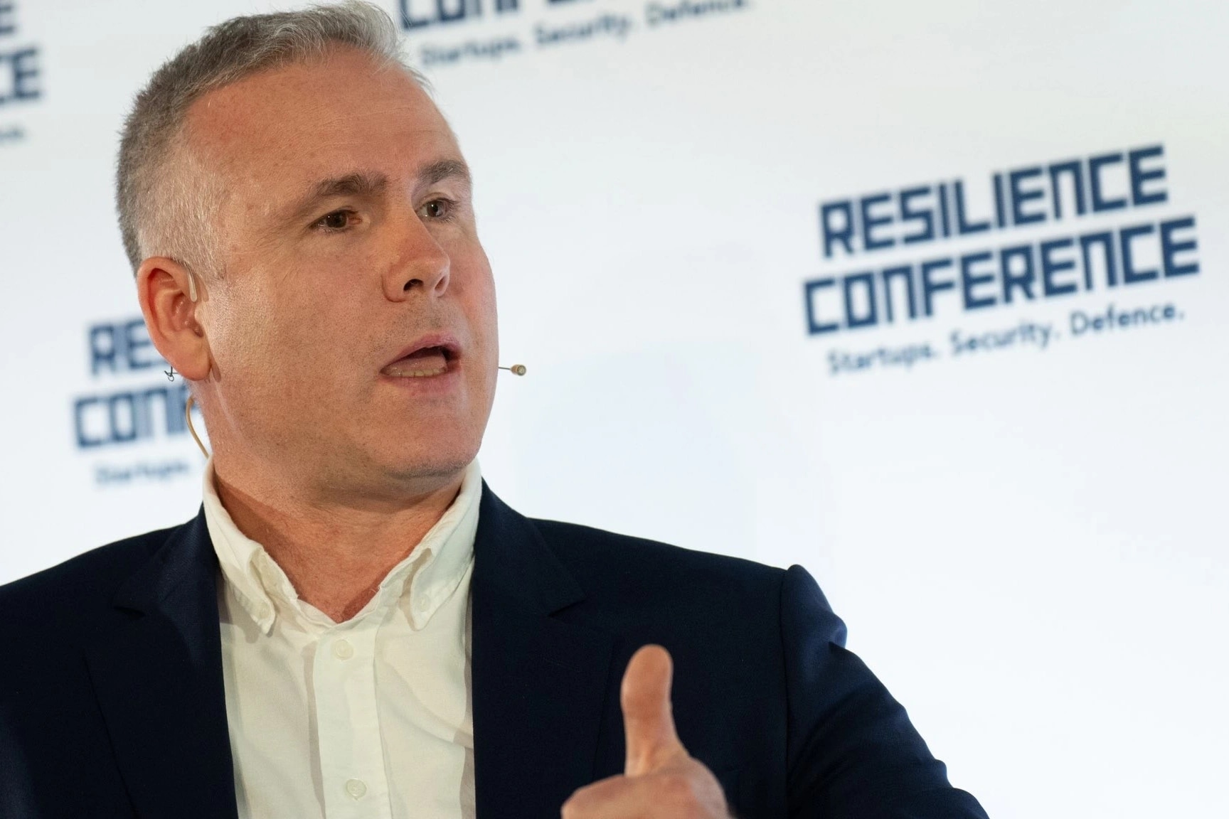 HMGCC CEO George Williamson speaking on stage at the Resilience Conference 