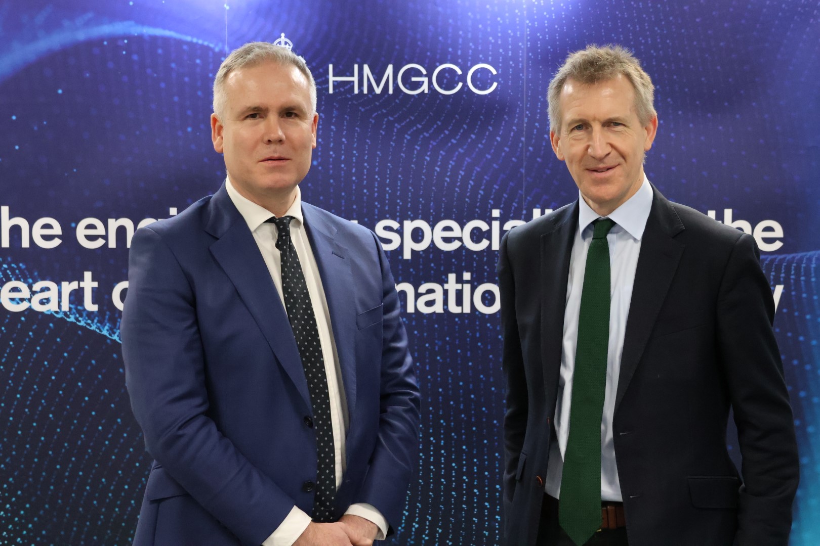 HMGCC Chief Executive George Williamson standing with Security Minister Dan Jarvis